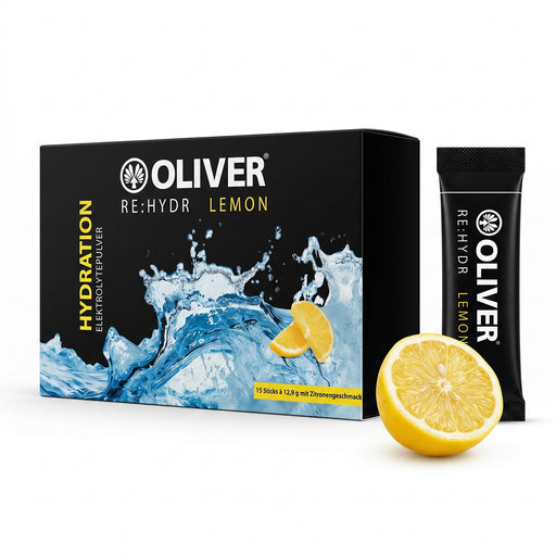 Verpackung der OLIVER RE:HYDR Lemon Elektrolytepulver-Box mit 15 Sticks und einzelner schwarzer Stickpackung neben einer aufgeschnittenen Zitrone
