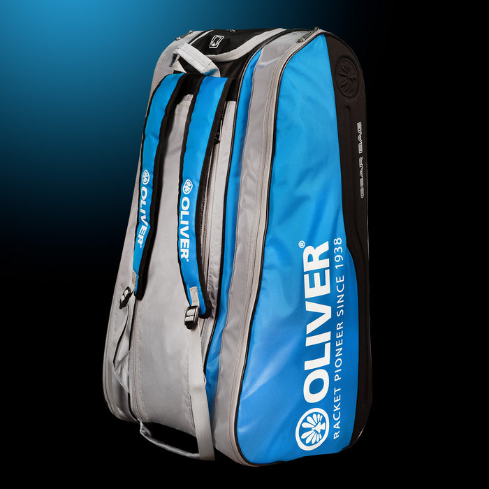 OLIVER Gearbag Extend in blau, grau und schwarzer Farbe auf dunklem Hintergrund.