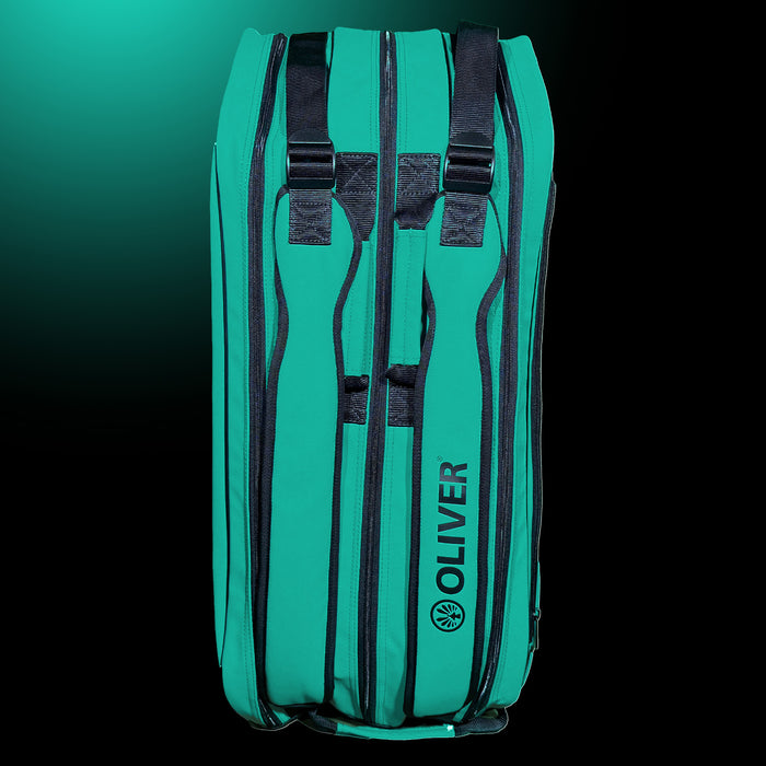 OLIVER RACKETBAG TOP PRO Extend in türkisgrün mit OLIVER Logo. Mit zwei Tragegriffen und Zwei Schultergurten  auf dunklem Hintergrund.
