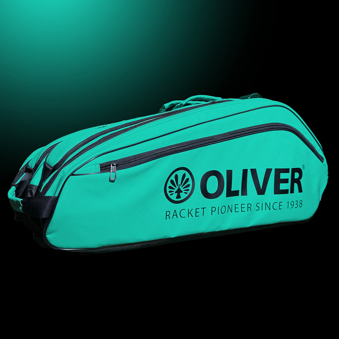 OLIVER RACKETBAG TOP PRO Extend in türkisgrün mit OLIVER Logo und langer Reißverschlusstasche auf dunklem Hintergrund.