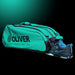 OLIVER RACKETBAG TOP PRO Extend in türkisgrün mit OLIVER Logo und geöffnetem Schuhfach mit OLIVER Sportschuh auf dunklem Hintergrund.