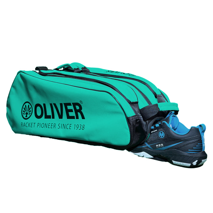 OLIVER RACKETBAG TOP PRO Extend in türkisgrün mit OLIVER Logo und geöffnetem Schuhfach mit OLIVER Sportschuh auf weißem Hintergrund.